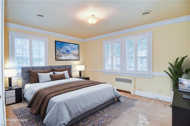 bedroom featuring ornamental molding, multiple windows, and radiator heating unit