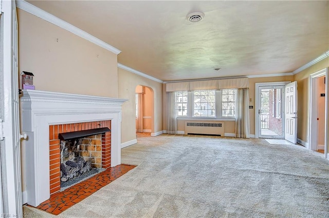 living room featuring baseboards, arched walkways, radiator, carpet floors, and a fireplace