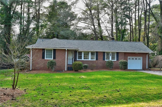 single story home with a garage, driveway, a shingled roof, a front yard, and brick siding