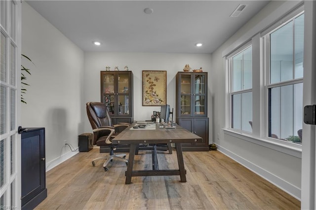 home office featuring light wood-type flooring, baseboards, and recessed lighting