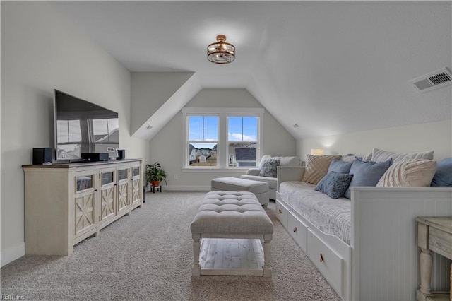 interior space with lofted ceiling, visible vents, and baseboards