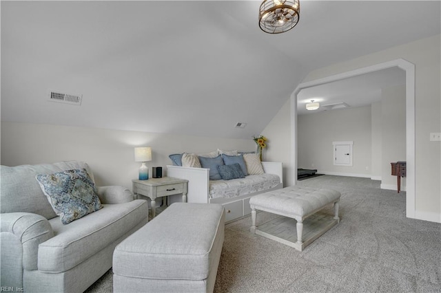 living room featuring lofted ceiling, baseboards, visible vents, and carpet flooring