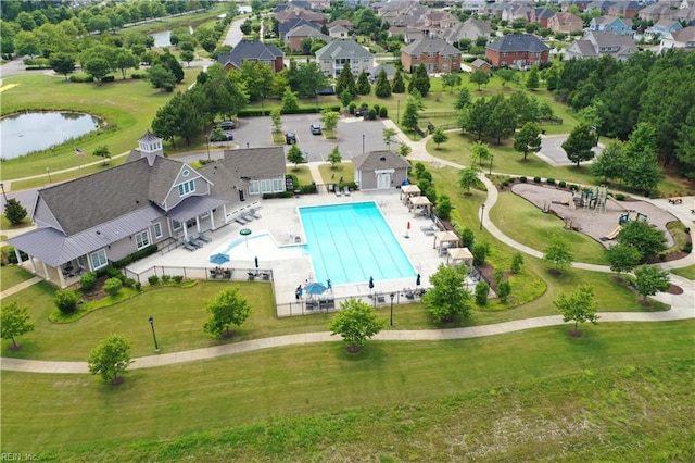 bird's eye view featuring a water view and a residential view