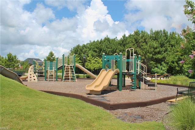 communal playground featuring a yard