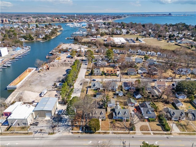 birds eye view of property featuring a water view and a residential view