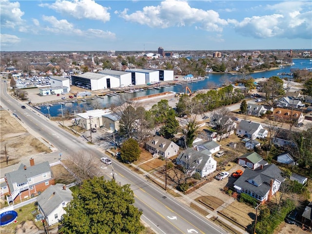 birds eye view of property with a water view and a residential view