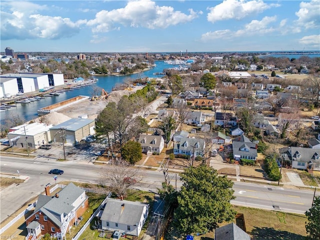 drone / aerial view featuring a residential view and a water view