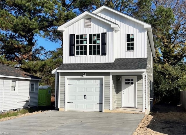 view of front of house with a garage, driveway, a shingled roof, and board and batten siding