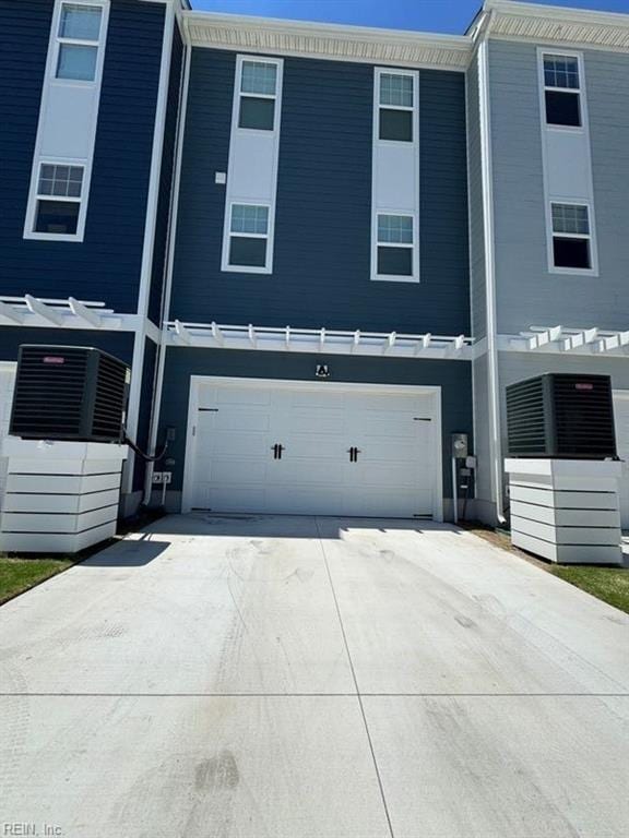 exterior space featuring driveway and a garage