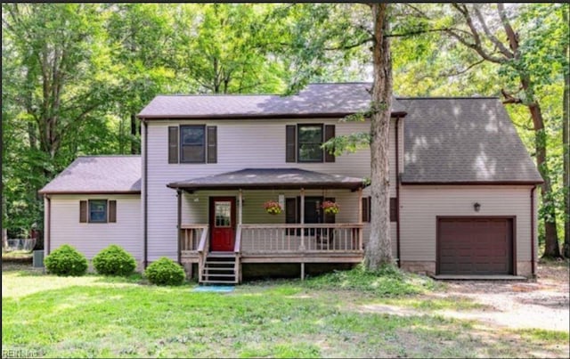 view of front of property featuring a garage and a front yard