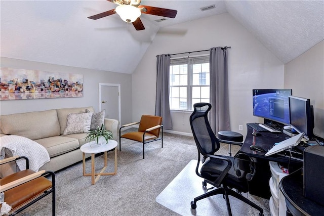 carpeted office featuring vaulted ceiling, ceiling fan, a textured ceiling, and visible vents