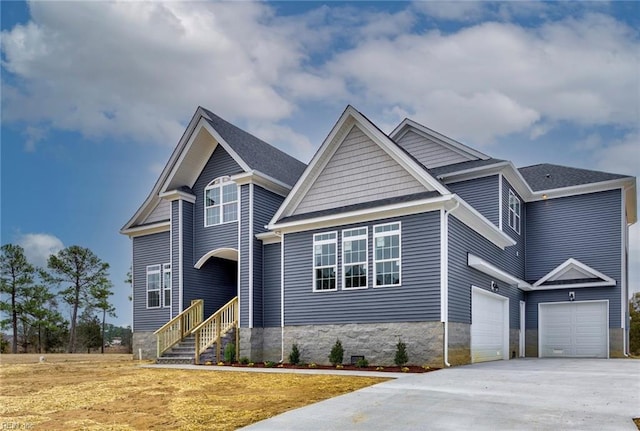 craftsman house with a garage and concrete driveway