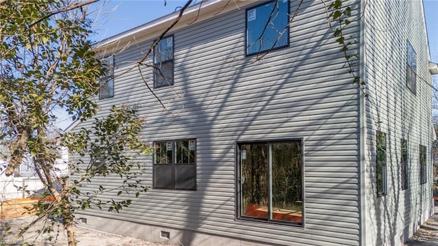 view of property exterior with crawl space