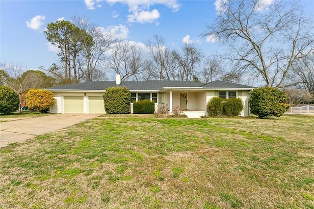 ranch-style house featuring a garage, a chimney, a front lawn, and concrete driveway