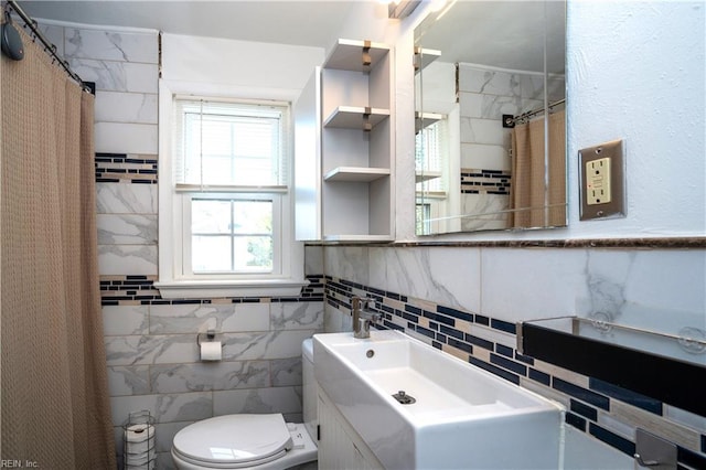 full bath featuring toilet, tile walls, and vanity