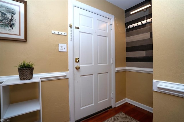 interior space featuring dark wood finished floors and baseboards