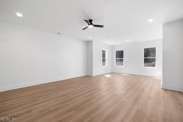 unfurnished living room featuring a ceiling fan, recessed lighting, and light wood-style floors