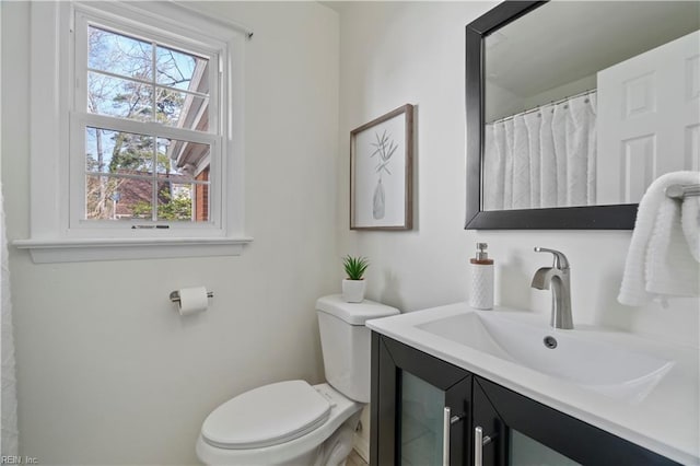 full bathroom featuring vanity and toilet