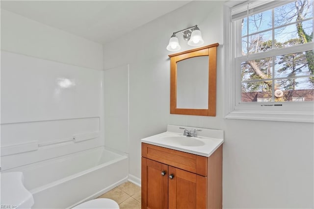 bathroom with tile patterned floors, plenty of natural light, bathtub / shower combination, and vanity
