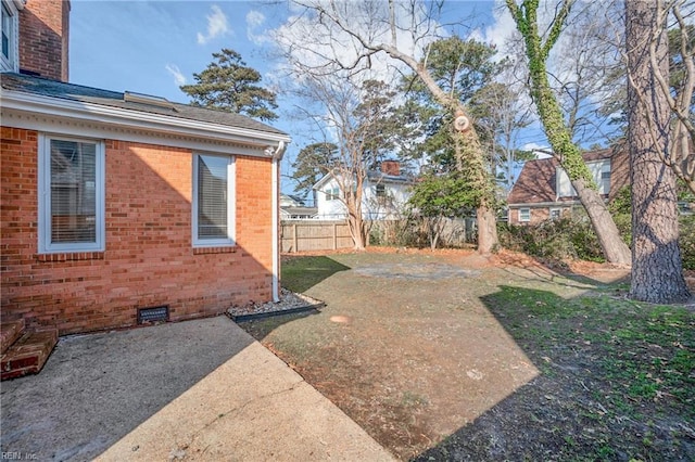 view of yard with a patio and fence