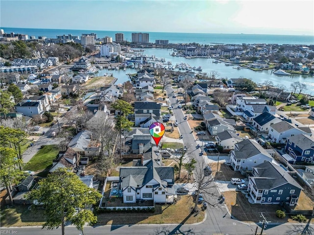 birds eye view of property featuring a water view