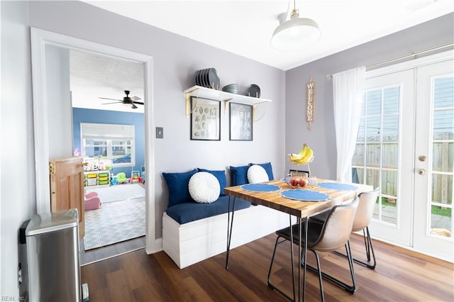 dining room with french doors, baseboards, visible vents, and wood finished floors