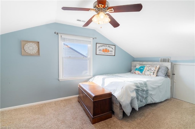 bedroom featuring visible vents, baseboards, lofted ceiling, and carpet