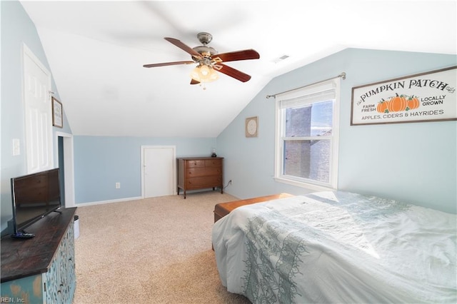 bedroom with visible vents, carpet flooring, lofted ceiling, and ceiling fan