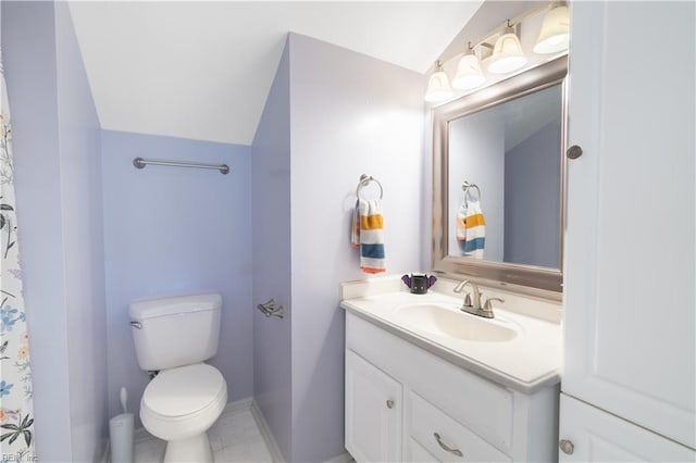 bathroom with vanity, baseboards, tile patterned flooring, vaulted ceiling, and toilet