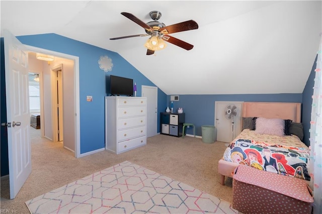 bedroom featuring visible vents, baseboards, ceiling fan, vaulted ceiling, and carpet flooring