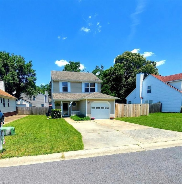 traditional home with fence, a front lawn, and concrete driveway