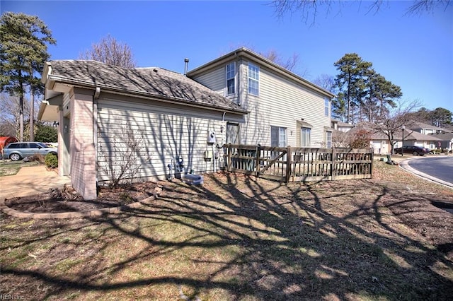 back of house featuring a wooden deck