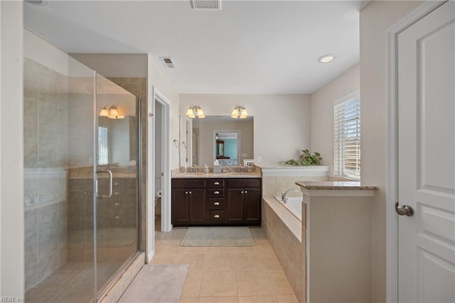 full bathroom with toilet, a shower stall, vanity, tile patterned flooring, and a bath