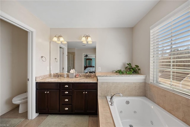 full bath with double vanity, toilet, ensuite bathroom, a jetted tub, and a sink