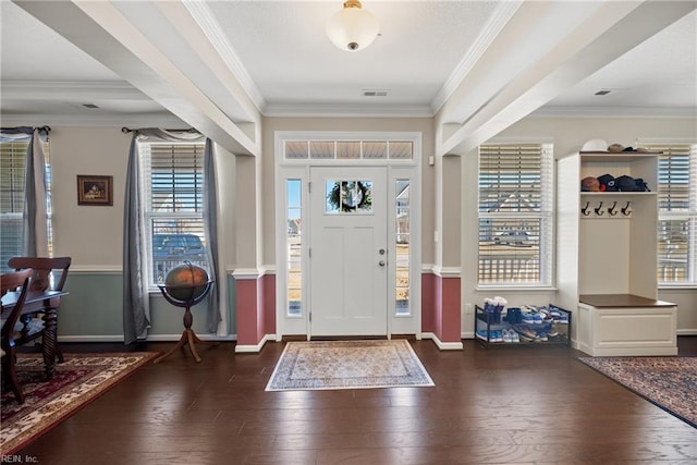 entryway featuring baseboards, wood finished floors, visible vents, and crown molding