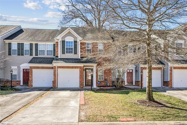 multi unit property with an attached garage, brick siding, a shingled roof, concrete driveway, and a front yard