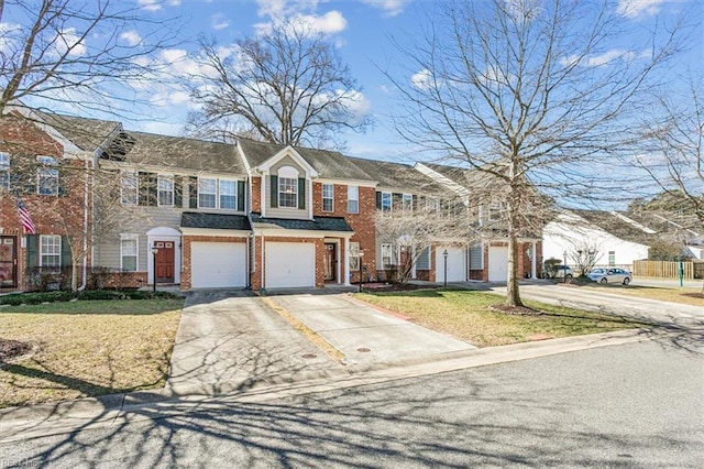 townhome / multi-family property with a garage, concrete driveway, brick siding, and a front lawn