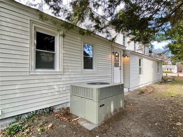 view of side of property featuring central air condition unit