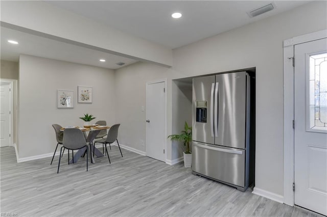 dining space with light wood-style flooring, visible vents, baseboards, and recessed lighting