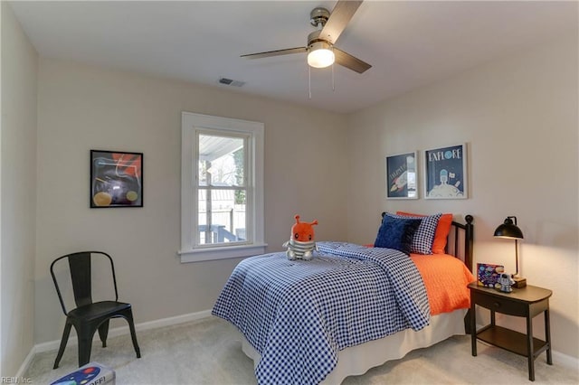 bedroom with carpet floors, a ceiling fan, visible vents, and baseboards