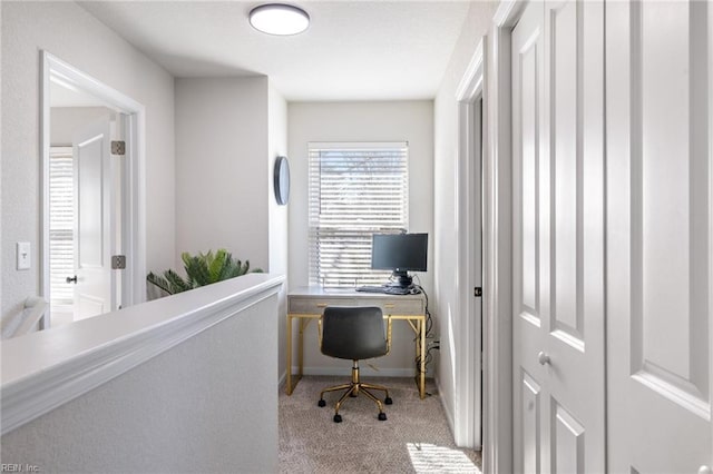 office space with carpet flooring and baseboards