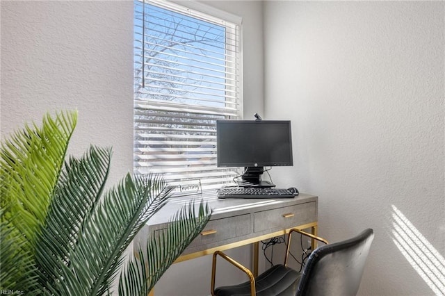 home office featuring a textured wall