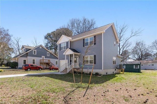 view of front of house featuring a garage, a front lawn, and crawl space