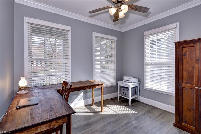 home office with ornamental molding, wood finished floors, a ceiling fan, and baseboards