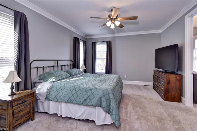 bedroom with ceiling fan, carpet floors, ornamental molding, and baseboards