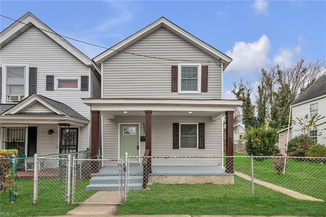 view of front facade with a fenced front yard, a gate, a front lawn, and a porch