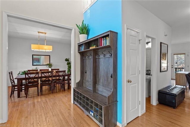 mudroom with light wood finished floors