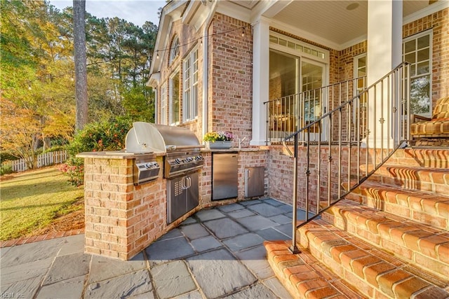 view of patio with a grill and exterior kitchen