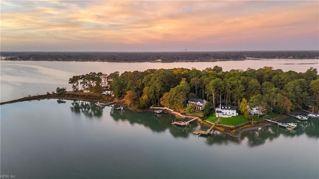 aerial view at dusk with a water view