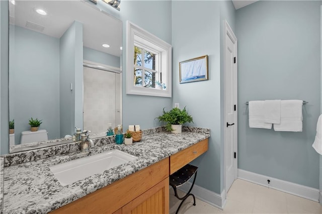 full bath featuring toilet, recessed lighting, baseboards, tiled shower, and vanity